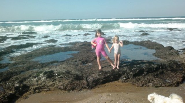 Kids and Gemma on beach.
