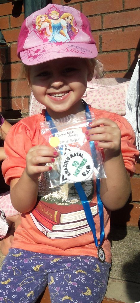 J with Swimming Badge and Medal